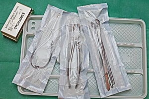 Steril dentist tools on a plastic plate photo