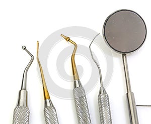 Dental tools for cleaning the teeth and checking the caries