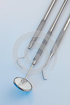 Dental tools in a clinical blue light