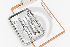 Dental tools, equipment and dental chart on white background