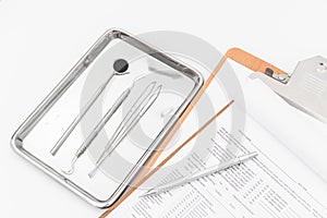 Dental tools, equipment and dental chart on white background