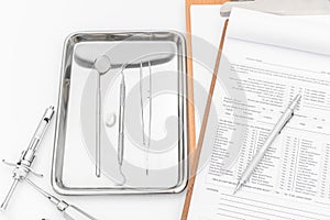 Dental tools, equipment and dental chart on white background