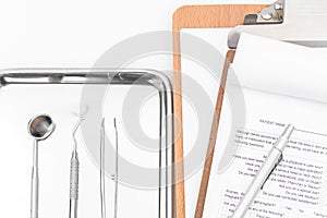Dental tools, equipment and dental chart on white background