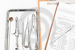 Dental tools, equipment and dental chart on white background