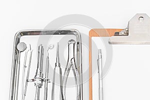 Dental tools, equipment and dental chart on white background