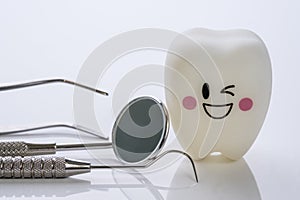 Dental tools and smile teeth model.