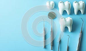 Dental Tools and Teeth Models on Light Blue Background