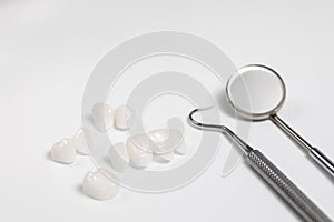 Dental tools and tooth implant isolated on white background.