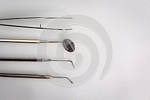 Dental tools on white background top view. Stomatology
