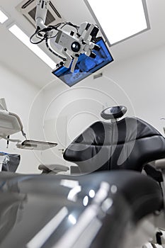 Dental treatment clinic interior with modern patient chair