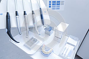 Dental treatment tools with nozzles