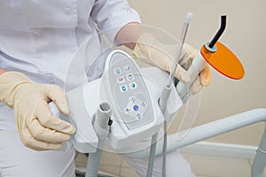 Dental UV curing light lamp . Ultraviolet polymerization Light Tool With Orange blocking glass. tooth care concept.