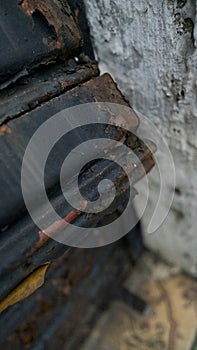 Dented and rusty steel commercial door photo