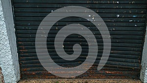 Dented and rusty steel commercial door photo