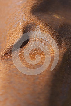 Dented smooth rusty red metal photo