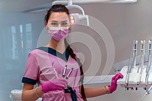 Dentis in pink uniform at the clinic
