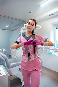 Dentis in pink uniform at the clinic