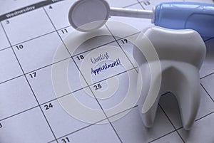 Dentist appointment concept with a calendar and dental equipment's