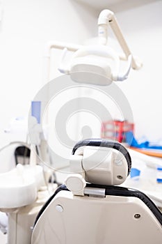 Dentist chair seen from behind. dentistry, medicine, medical equipment and stomatology concept. Vertical