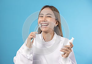 Dentist demonstrating a jaw model and a dental instrument. The notion of oral hygiene