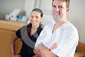Dentist, dental assistant and clinic in portrait, smile and office for oral, health and stomatology. Man, woman and
