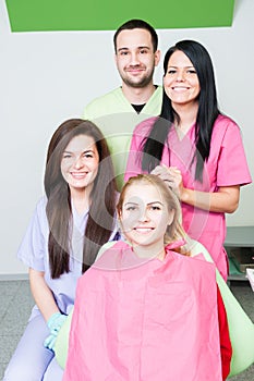 Dentist doctor and assistants in dental office