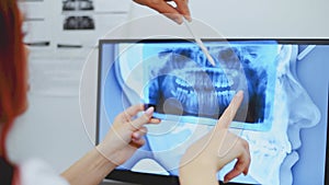 Dentist doctor checking dental x-ray orthopantomogram. Dental panoramic radiography