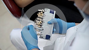 Dentist doctor with color teeth pallete for whitening