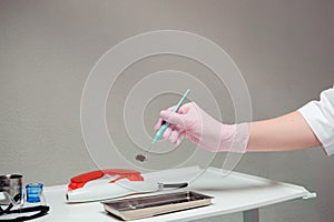 Dentist doctor hand holding dentist tools in Dentist Clinic.