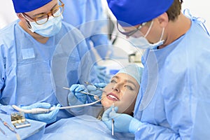 Dentist Doctor and his Team Treating a Patient