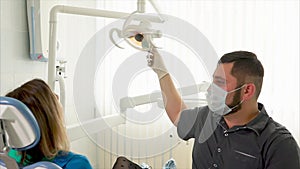 The dentist doctor includes a lamp to examine the oral cavity of the patient