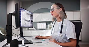 Dentist Doctor Looking At Teeth Xray