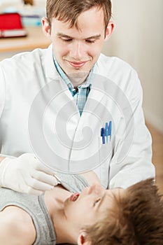 Dentist doing kid examination