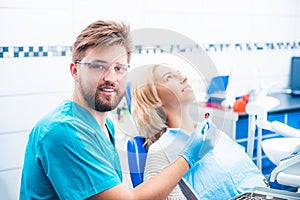 Dentist examinating girl