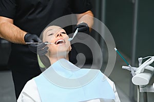 Dentist examining patient's teeth, close up