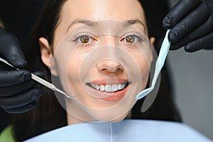 Dentist examining a patient's teeth in the dentist