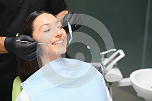 Dentist examining a patient's teeth in the dentist