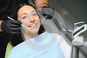 Dentist examining a patient's teeth in the dentist