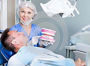Dentist explaining future treatment to patient