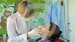 Dentist Fitting Braces In Girlâ€™s Mouth