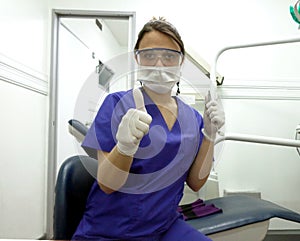 Dentist with gloves, mask, mirror and explorer