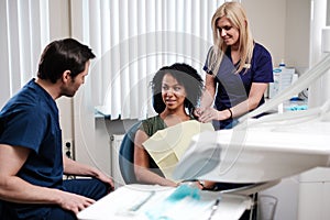 Dentist and his assitant working in private practice