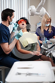 Dentist and his assitant working in private practice