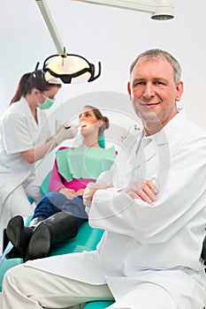 Dentist in his surgery