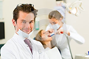 Dentist in his surgery