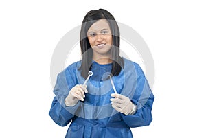 Dentist holding dental instuments