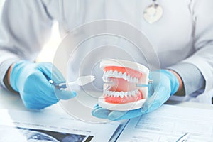 Dentist learning how to brush teeth