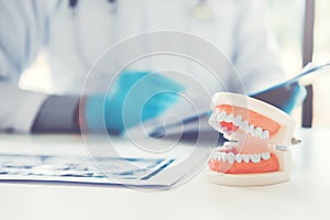 Dentist learning how to brush teeth