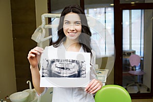 Dentist looking at x-ray picture