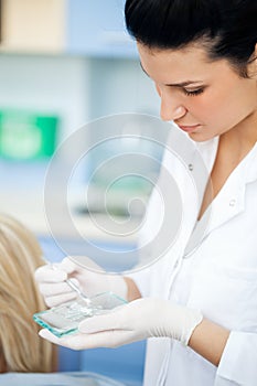 Dentist making fillings